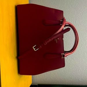 Kate Spade, medium tote color burgundy.